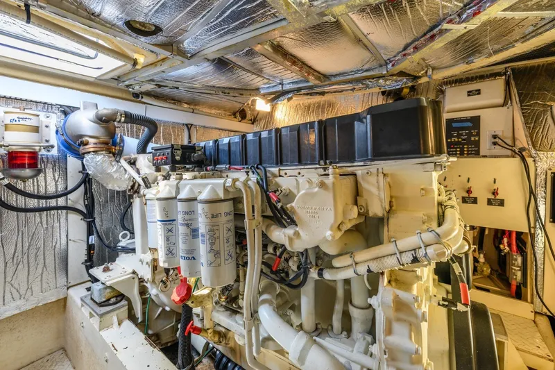 Slide: The Image of Engine room of 2003 Cruisers 5470 Express yacht, featuring Volvo Penta components. - 39
