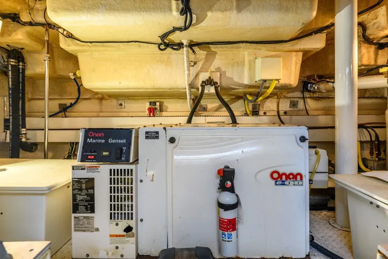 Slide: The Image of Engine room of 2003 Cruisers 5470 Express with Onan Marine Genset. - 36