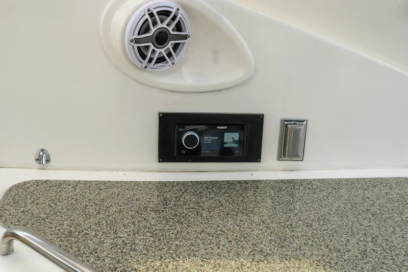 Slide: The Image of 2003 Cruisers 5470 Express boat audio system with speaker and control panel. - 27