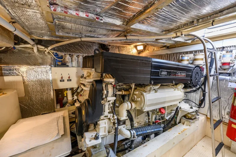 Slide: The Image of Engine room of 2003 Cruisers 5470 Express yacht with Volvo Penta engine. - 38