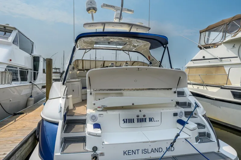 Slide: The Image of 2003 Cruisers 5470 Express yacht docked at Kent Island marina. - 21
