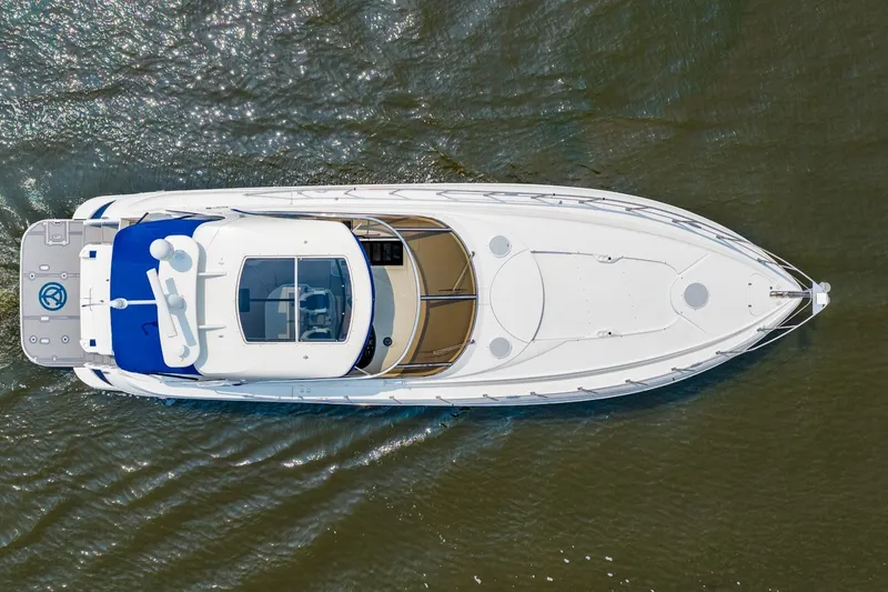 Slide: The Image of Aerial view of 2003 Cruisers 5470 Express yacht on water. - 14