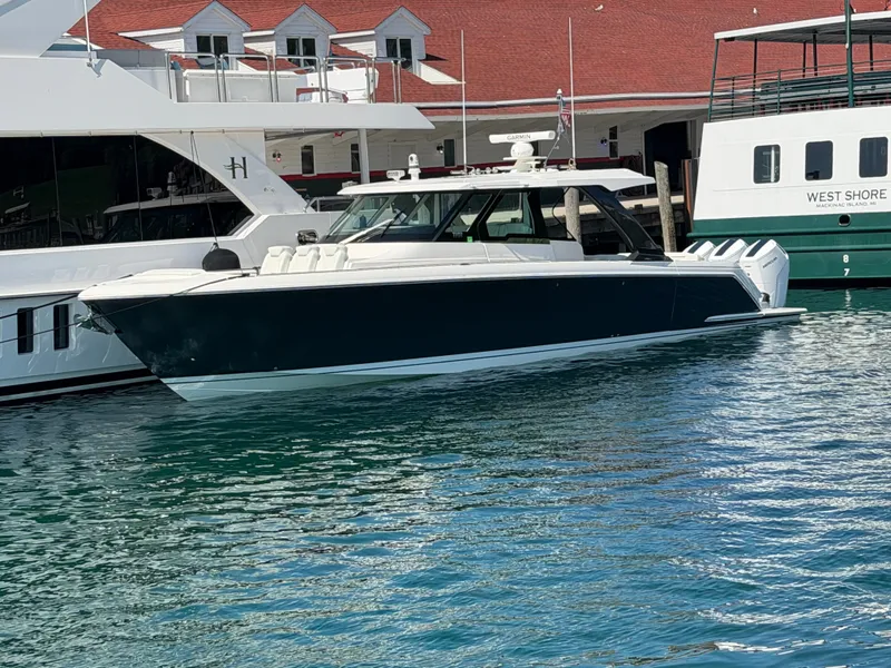 Slide: The Image of 2026 Tiara Yachts 48 LS docked, featuring sleek design with modern structure and luxurious details. - 2
