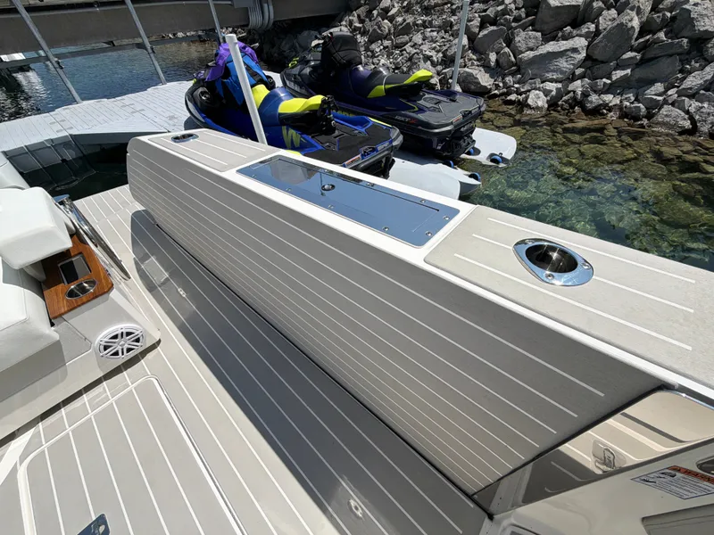 Slide: The Image of The image shows the deck of a 2026 Tiara Yachts 48 LS with sleek details. - 18