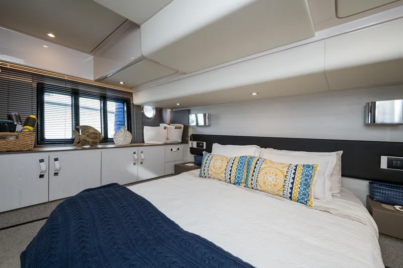 Slide: The Image of Luxurious bedroom interior of 2020 Azimut Fly 50 yacht with modern decor and cozy bedding. - 54