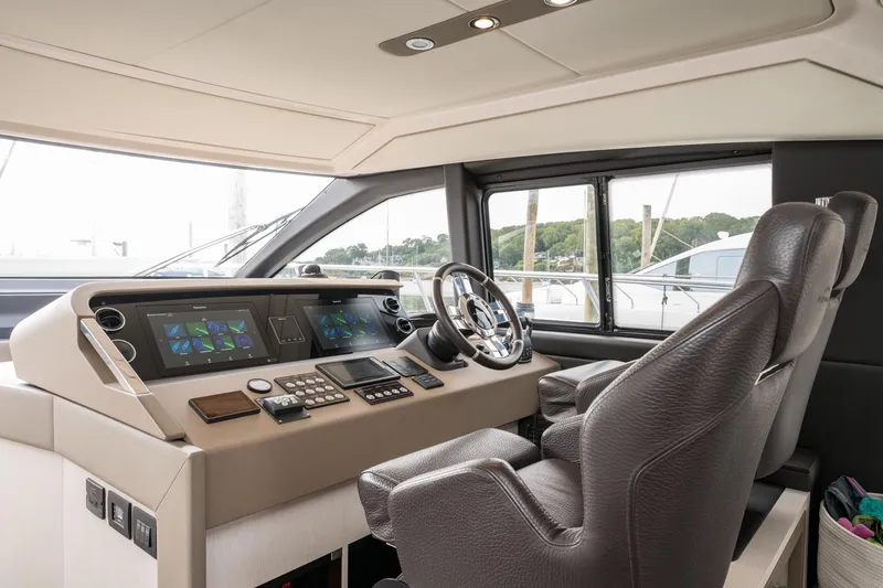 Slide: The Image of Luxurious helm of 2020 Azimut Fly 50 yacht with advanced navigation controls. - 48