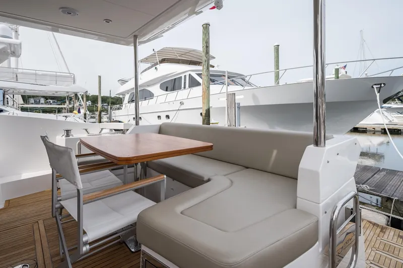 Slide: The Image of Azimut Fly 50 yacht 2020 model, featuring elegant outdoor seating and dining area. - 25