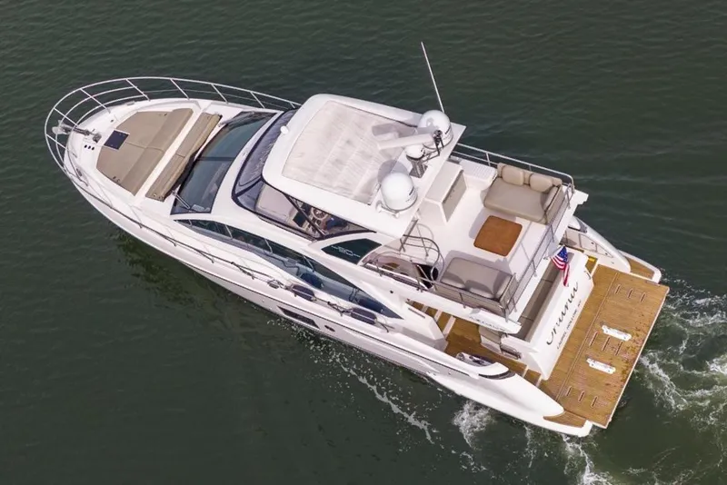 Slide: The Image of Aerial view of 2020 Azimut Fly 50 yacht cruising on calm water. - 12