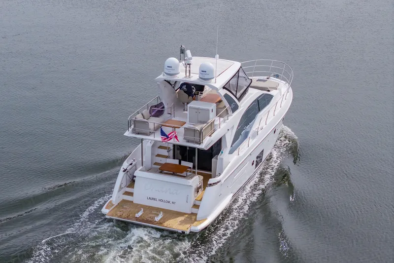 Slide: The Image of Azimut Fly 50 yacht cruising on water, rear view, 2020 model. - 8