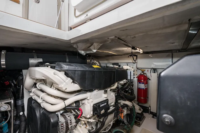 Slide: The Image of Engine room of 2020 Azimut Fly 50 yacht, featuring modern equipment and fire extinguisher. - 65