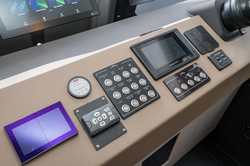 Slide: The Image of Control panel of 2020 Azimut Fly 50 yacht with various navigation instruments and displays. - 50