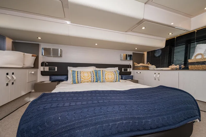 Slide: The Image of Luxurious Azimut Fly 50 yacht bedroom interior, 2020 model, featuring elegant decor and cozy bedding. - 53