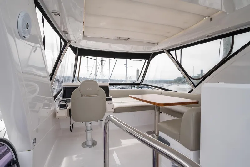 Slide: The Image of Interior of 2020 Azimut Fly 50 yacht with helm, seating, and table. - 34