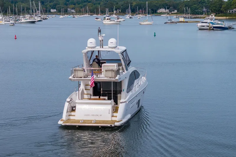 Slide: The Image of Azimut Fly 50 yacht cruising in a serene harbor, 2020 model. - 9