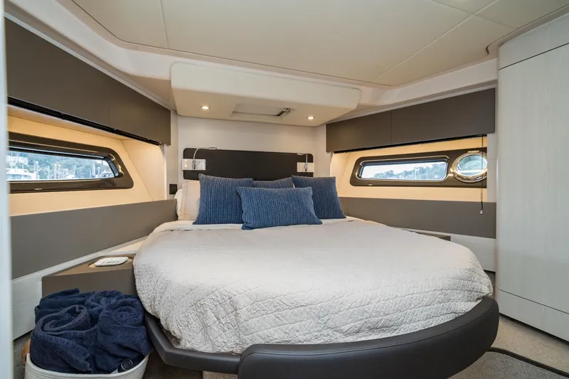 Slide: The Image of Luxurious bedroom interior of 2020 Azimut Fly 50 yacht with modern design and cozy bedding. - 57