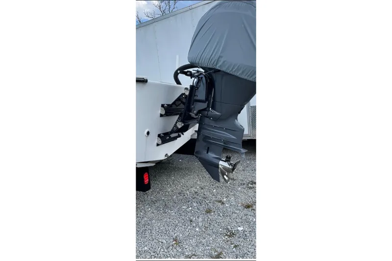 Slide: The Image of Outboard motor of 2022 May-Craft 2000 CC boat on gravel surface. - 20