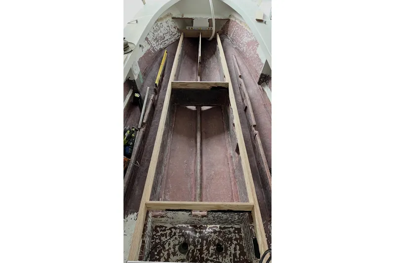 Slide: The Image of Interior view of a 2022 May-Craft 2000 CC boat under renovation. - 12