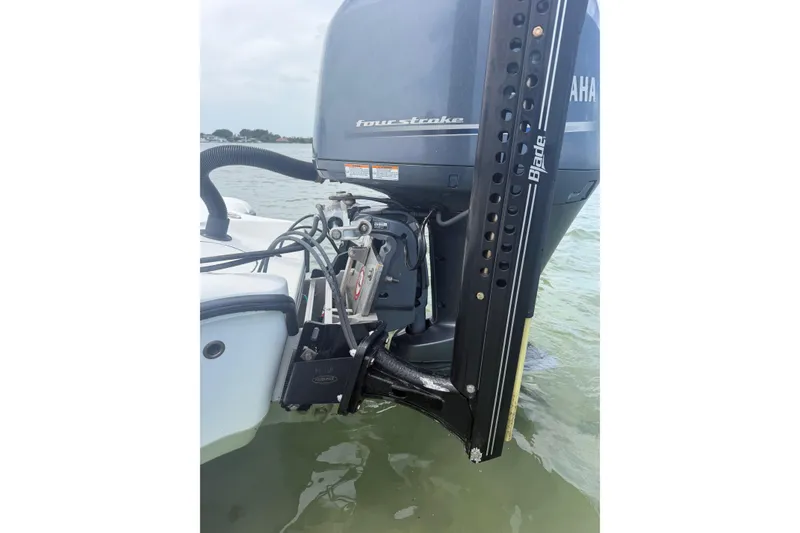Slide: The Image of 2019 Yellowfin 21 Bay boat with Yamaha four-stroke engine and Blade power pole in water. - 25