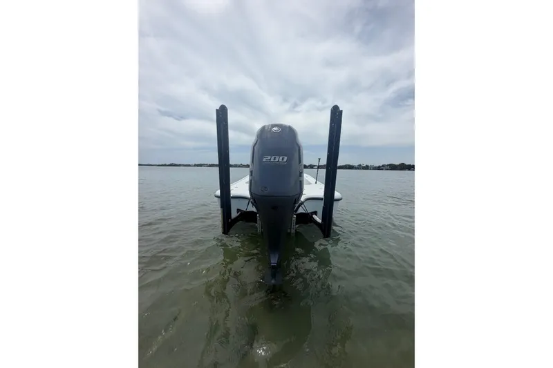 Slide: The Image of 2019 Yellowfin 21 Bay boat with 200 HP engine on calm water. - 3