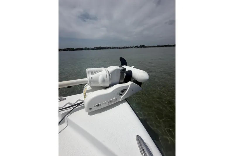Slide: The Image of 2019 Yellowfin 21 Bay boat with Minn Kota trolling motor on calm water. - 14