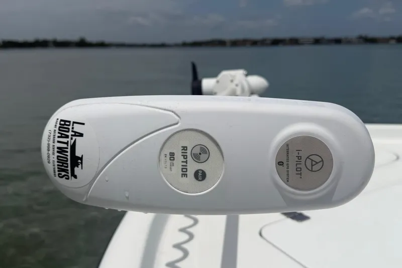Slide: The Image of Close-up of a 2019 Yellowfin 21 Bay boat's trolling motor control panel on water. - 13