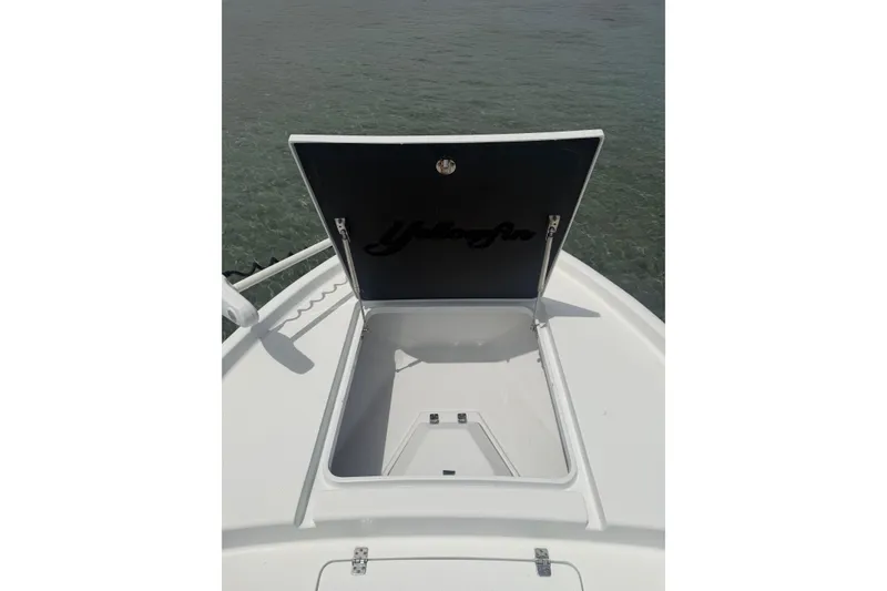 Slide: The Image of Open storage compartment on 2019 Yellowfin 21 Bay boat, showing interior space. - 11
