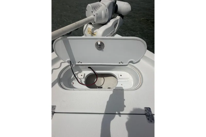 Slide: The Image of 2019 Yellowfin 21 Bay boat hatch with open compartment and wiring. - 10