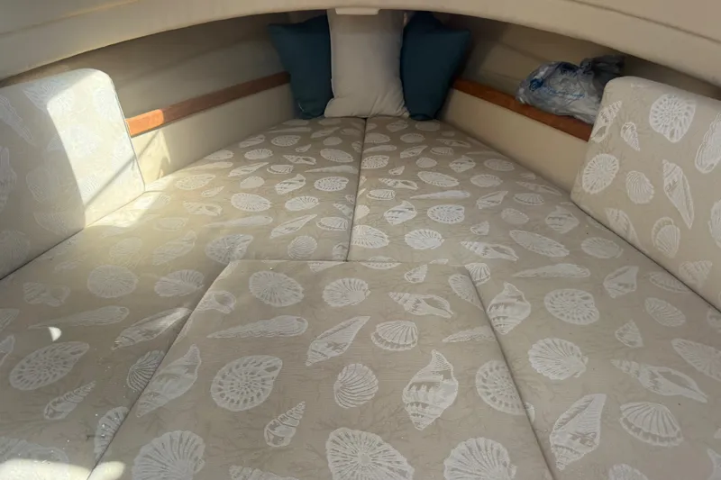 Slide: The Image of Interior cabin of 2012 Ranger Tugs R-21 EC with shell-patterned upholstery. - 22