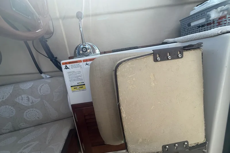 Slide: The Image of Interior of 2012 Ranger Tugs R-21 EC boat with steering wheel and seat. - 23