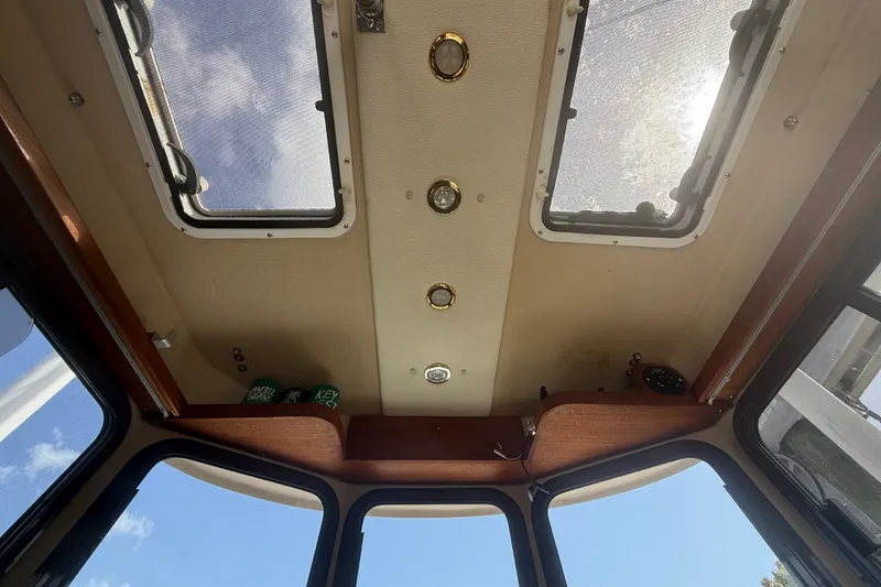 Slide: The Image of Interior view of 2012 Ranger Tugs R-21 EC boat ceiling with windows and lights. - 19