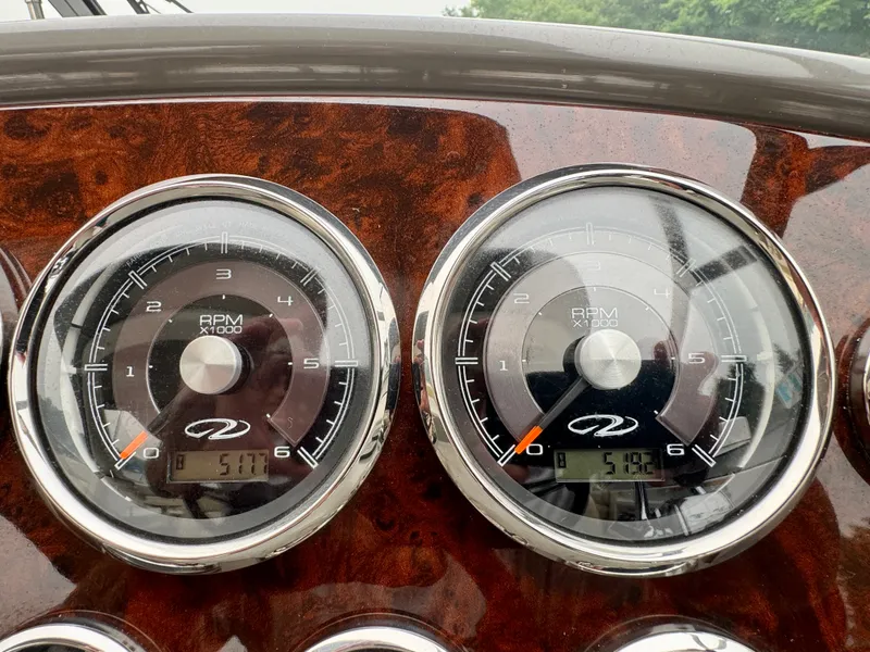 Slide: The Image of Close-up of two tachometers on a Regal 3550 Cuddy boat. - 26