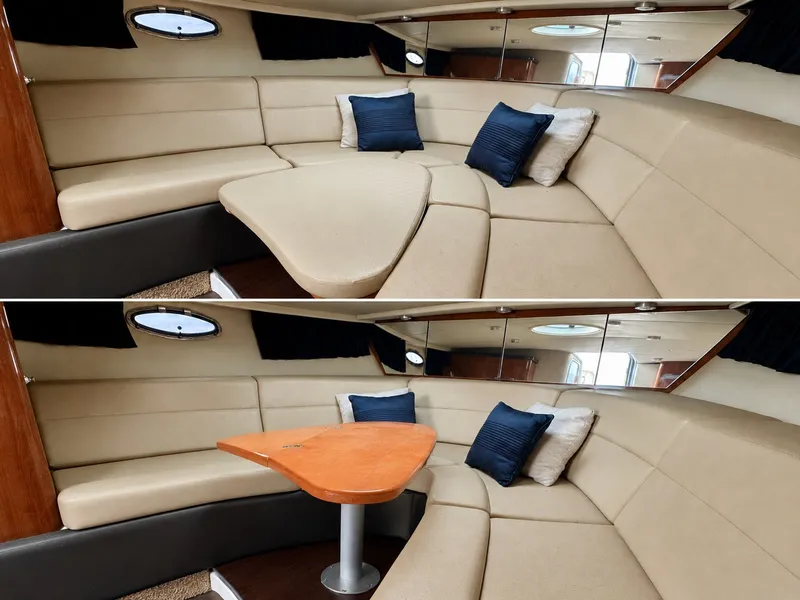 Slide: The Image of Interior of the 2012 Regal 3550 Cuddy with beige upholstery and blue cushions. - 33