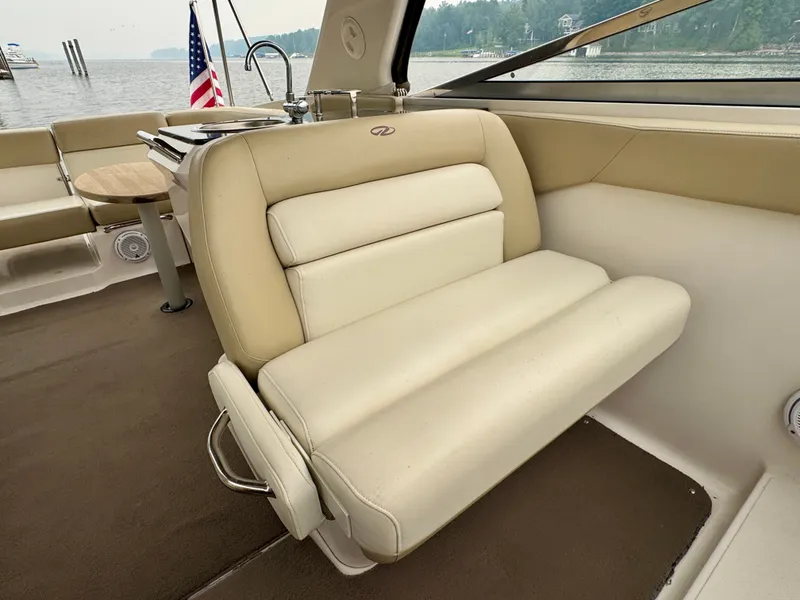 Slide: The Image of The image shows the cockpit of a 2012 Regal 3550 Cuddy with beige seating. - 30
