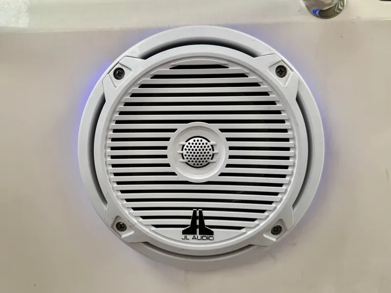 Slide: The Image of A JL Audio speaker is mounted in the wall of a Regal 3550 Cuddy boat. - 43