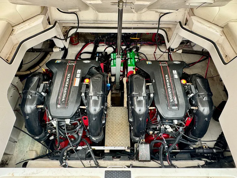 Slide: The Image of Two Volvo Penta engines in the engine compartment of a 2012 Regal 3550 Cuddy. - 49