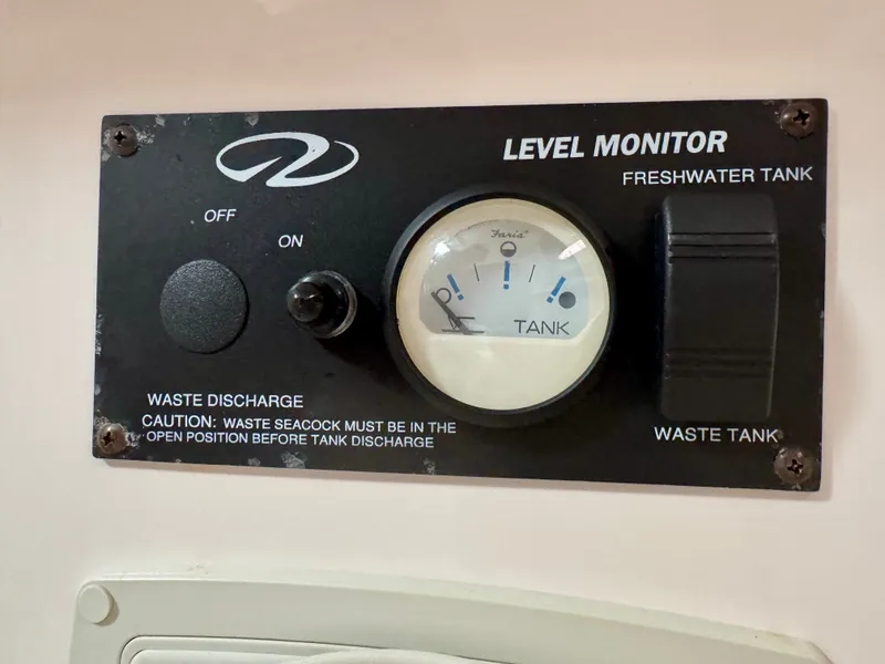 Slide: The Image of A 2012 Regal 3550 Cuddy with a level monitor for freshwater and waste tanks. - 47