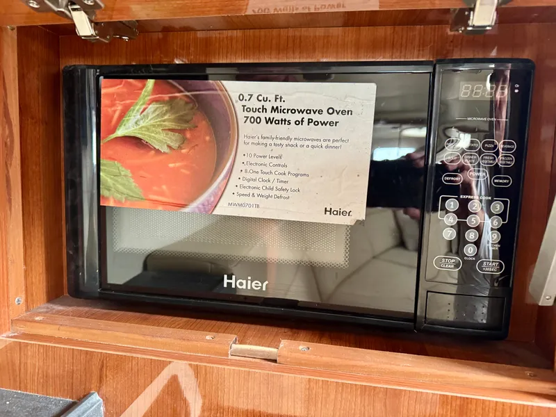 Slide: The Image of Microwave in a 2012 Regal 3550 Cuddy, featuring 0.7 cubic feet and 700 watts of power. - 46