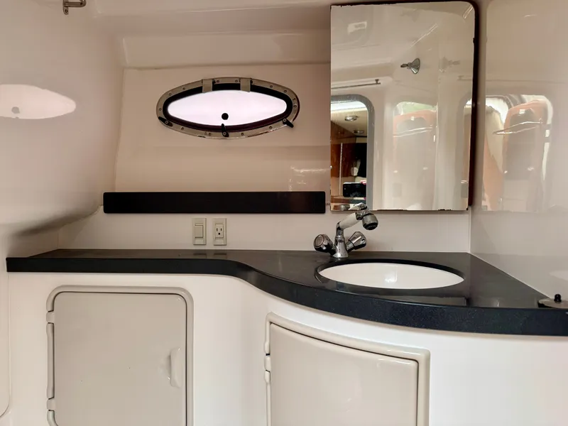 Slide: The Image of Interior of the 2012 Regal 3550 Cuddy with sink and mirror. - 34