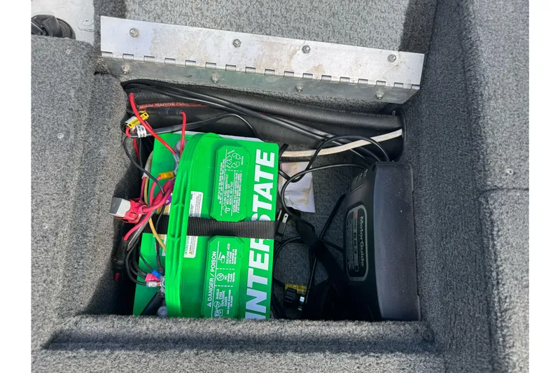 Slide: The Image of Battery compartment of a 2011 Lund 1625 Rebel XL Sport boat with Interstate batteries. - 15