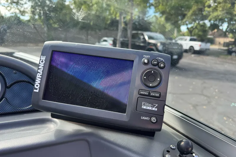 Slide: The Image of Lowrance Elite-7 CHIRP fishfinder on 2011 Lund 1625 Rebel XL Sport boat dashboard. - 10