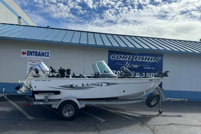 Slide: The Image of 2011 Lund 1625 Rebel XL Sport boat on trailer at Gone Fishin' Marine dealership. - 1