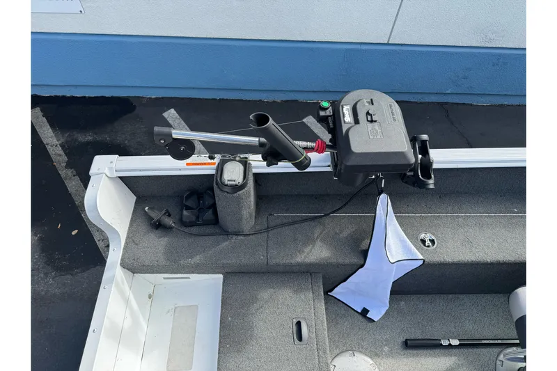 Slide: The Image of 2011 Lund 1625 Rebel XL Sport boat interior with motor and accessories. - 7