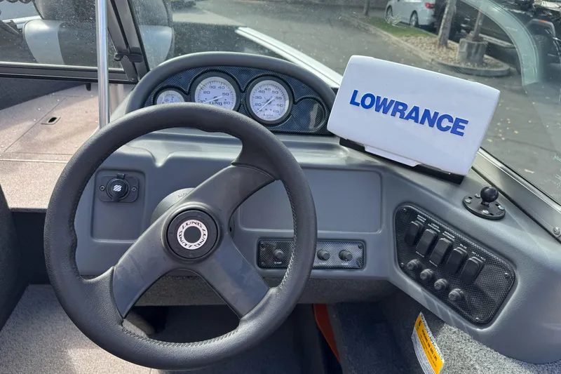 Slide: The Image of Steering wheel and dashboard of 2011 Lund 1625 Rebel XL Sport boat with Lowrance device. - 9