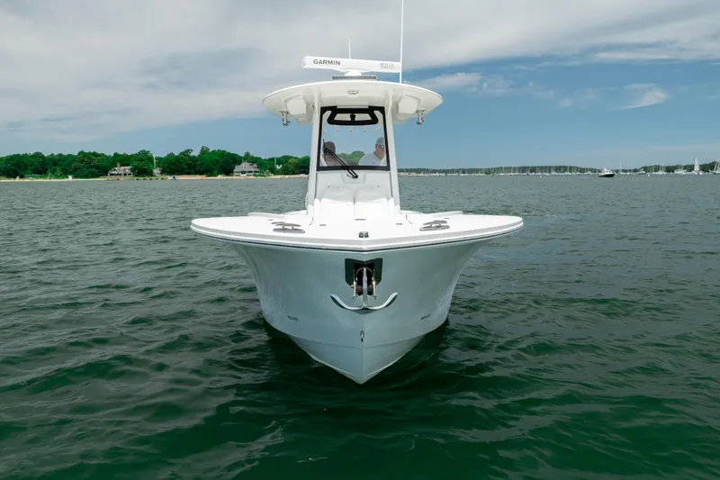 The Image of 2021 Regulator 28 Forward Seating boat on calm water, front view. - 1