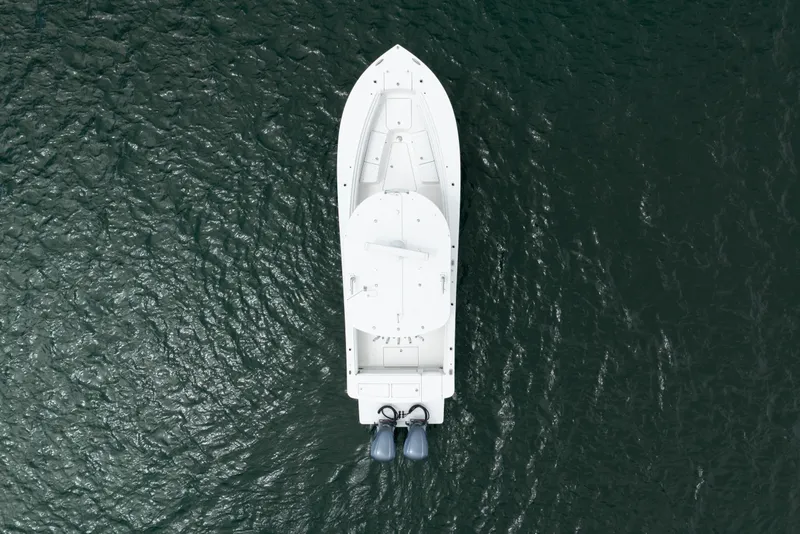 Slide: The Image of Aerial view of 2021 Regulator 28 Forward Seating boat on water. - 10