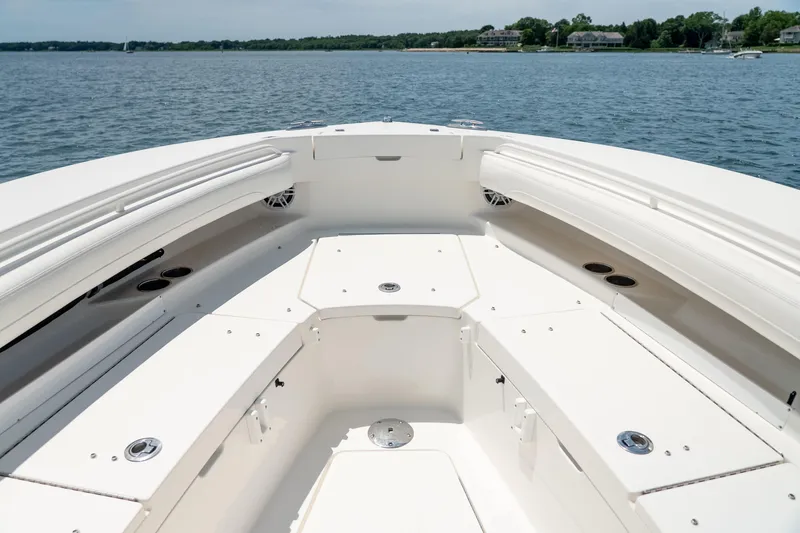 Slide: The Image of 2021 Regulator 28 Forward Seating boat interior with spacious deck and seating area. - 19