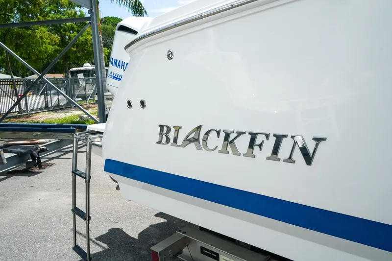 Slide: The Image of 2019 Blackfin 272 CC boat with Yamaha engine, parked outdoors. - 7