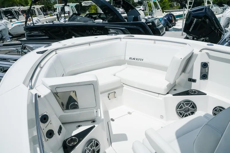 Slide: The Image of 2019 Blackfin 272 CC boat interior with white seating and modern amenities. - 19
