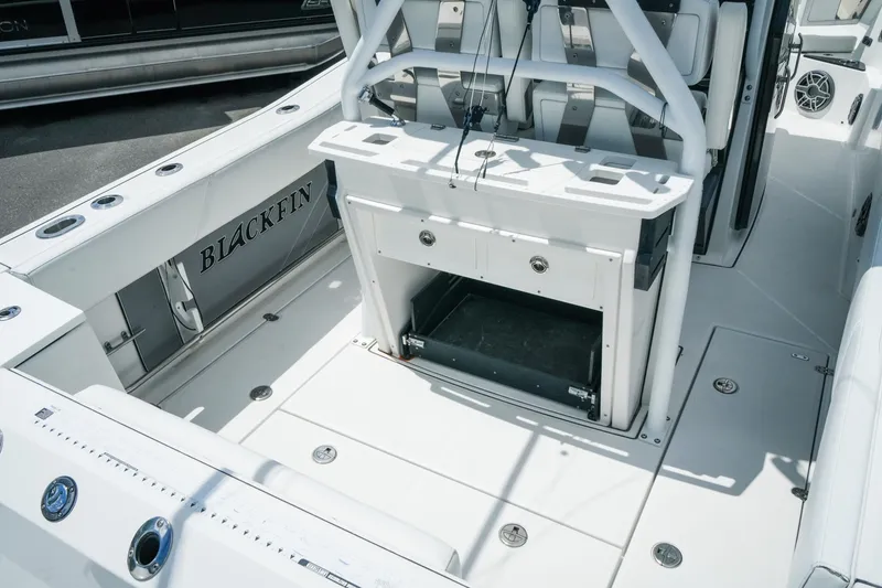 Slide: The Image of 2019 Blackfin 272 CC boat interior with seating and storage compartments. - 10