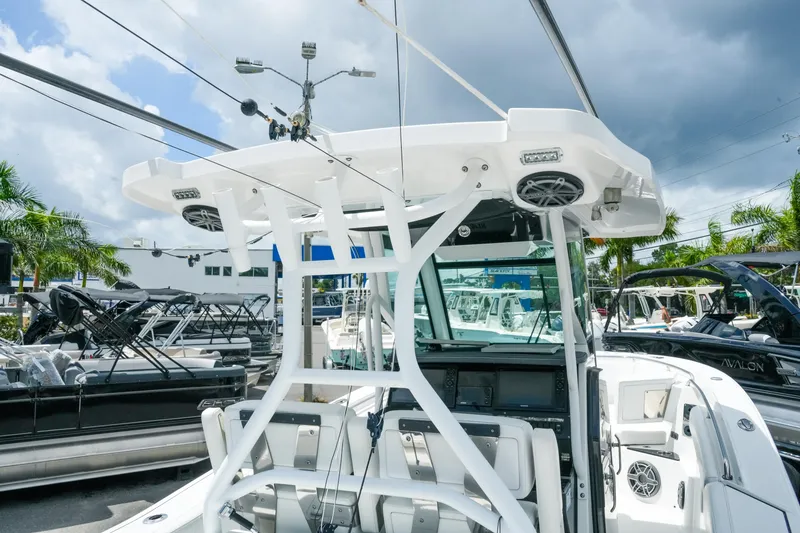 Slide: The Image of 2019 Blackfin 272 CC boat with advanced electronics and sleek design, showcased outdoors. - 11